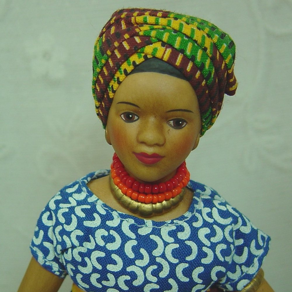 8" porcelain doll--dark skinned native woman carrying water jug - Picture 3 of 7